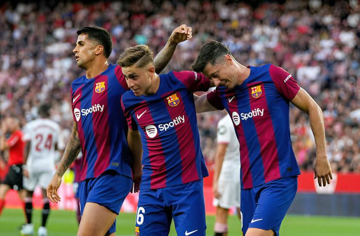 Barcelona menang 2-1 atas Sevilla pada laga terakhir Xavi Hernandez.